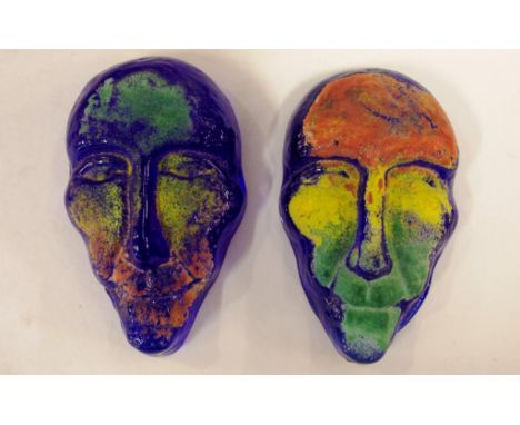 Two Kosta Boda mask art glass sculptures signed by Kjell Engman, 10cm high