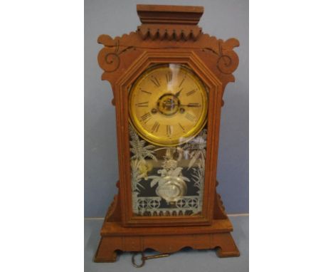 Antique American timber cased mantle clock with 8 day striking movement, together with key and pendulum, H49cm approx