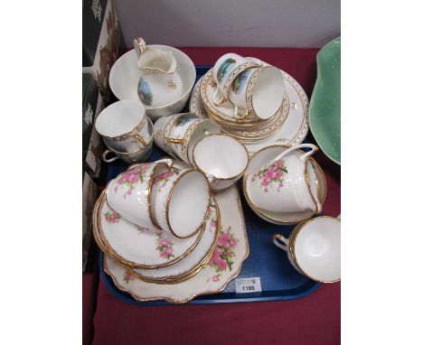 XIX Century Hand Painted Tea Service, of seventeen pieces, featuring lake land scenes, floral teaware:- One Tray.