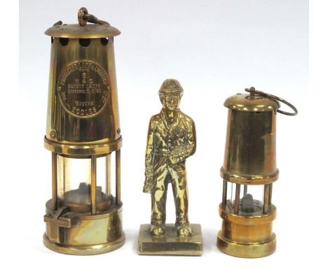 Eccles Brass Miners Safety Lamp, Type 6, 25cm, together with a smaller brass miners lamp and a brass figure of a miner. (3)