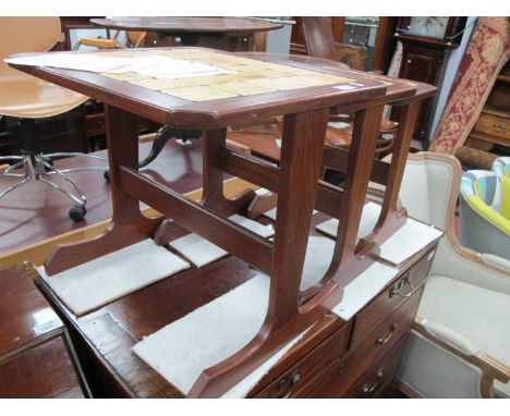 Teak Nest of Coffee Tables, circa 1970s with 30, 20 and 12 ceramic tile tops, on trestle supports, the widest 50cm.