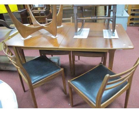 McIntosh of Kirkcaldy teak extending dining table circa 1970's with fold-out leaf on tapering legs 147.5cm W when closed. Set