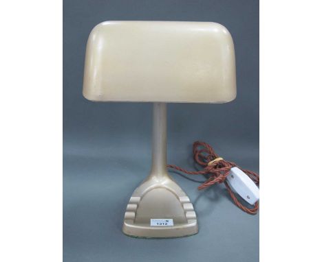 A Circa 1940's Art Deco Style Desk Lamp, gilt metal shade on ribbed stem over an ashtray style base, 32cm high.