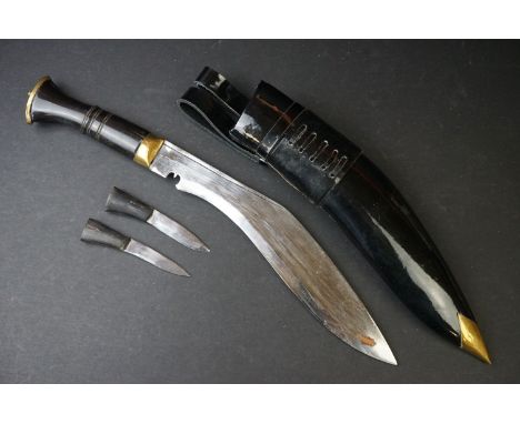 A Nepalese Gurkha kukuri knife complete with patent leather scabbard and tools. 