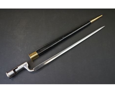 A Reproduction 19th century style British socket bayonet with leather scabbard with brass fittings. 