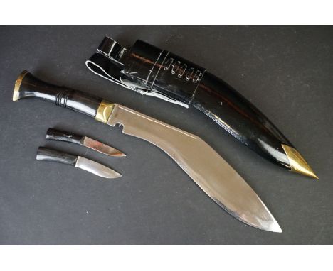 A Nepalese Gurkha kukuri knife complete with patent leather scabbard and tools. 