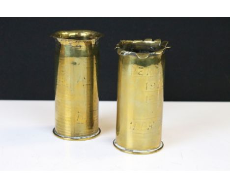 Two small trench art vases made from spent brass shell cases, one dated 1905 and the other 1888, both with worn inscriptions 
