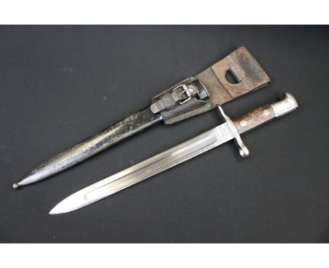 A Swiss M.1889 Maschinenfabrik Bern Bayonet together with scabbard and leather frog, serial no.37616 to cross guard. 