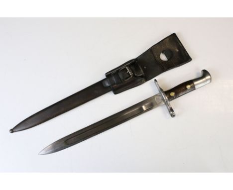 A Swiss M.1881 Waffenfabrik Neuhausen fullered bayonet complete with scabbard and leather frog. 