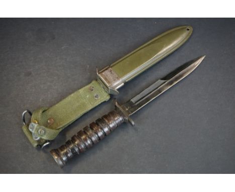 A United States Marine Corps M3 fighting knife with M8 scabbard.