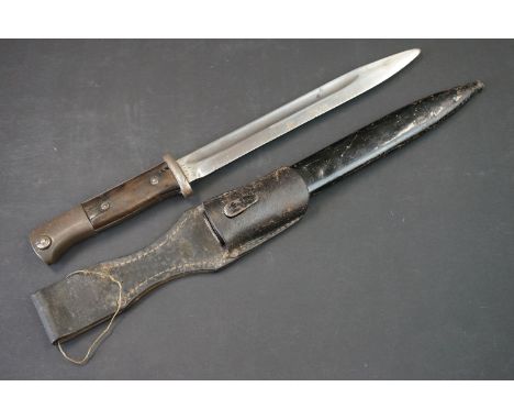 A World War Two German K98 Mauser Bayonet, the blade marked 41ffc / 4952, complete with scabbard and leather frog. 