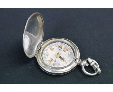 A British Military issued World War One marching compass, broad arrow marked and dated for 1918. 