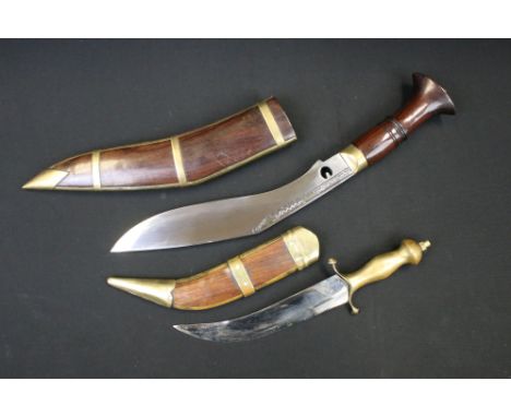 A Kukuri Knife With Wood And Brass Scabbard together with another similar. 