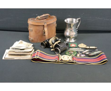 A group of military collectables to include World War Two Air Ministry issued binoculars, stable belt, photographs, tankard, 