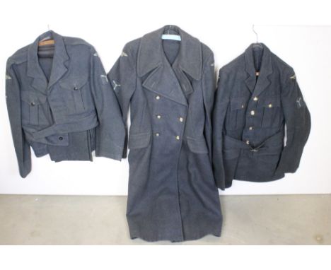 A British post World War Two Royal Air Force / RAF uniform to include greatcoat, blouse, jacket and trousers, all complete wi