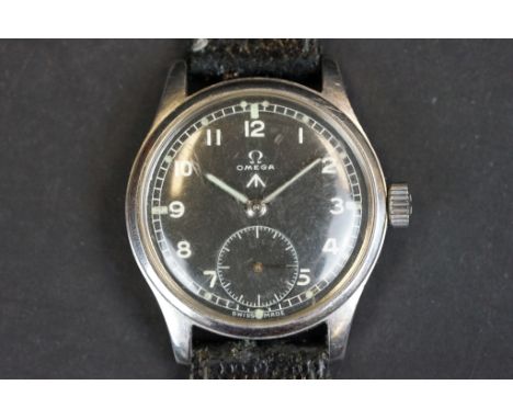 A British Military issued Omega wristwatch, black dial with Omega and Broad arrow mark, sub second dial to 6 o'clock, Omega l