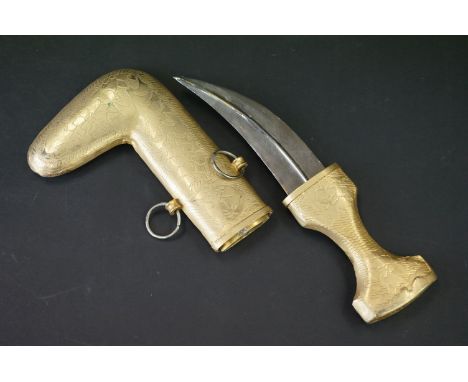 A Middle Eastern Jambiya knife With decorative gilt handle and scabbard. 