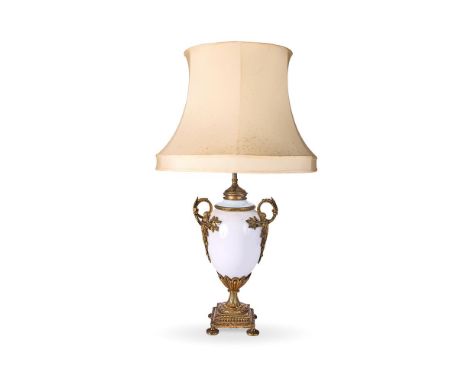 A GILT METAL MOUNTED MILK GLASS TABLE LAMP LATE 19TH CENTURY  Possibly French, adapted from an oil lamp  base 41.5cm high, 85