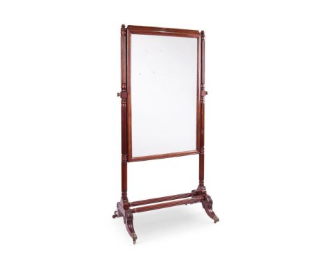 A REGENCY MAHOGANY CHEVAL MIRROR  EARLY 19TH CENTURY     The rectangular plate and moulded frame flanked by reeded and ring-t
