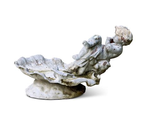 A SMALL LEAD FIGURE OF A CHILD ON A SHELL  20TH CENTURY  base approximately 43 by 38cm, height difficult to determine given c