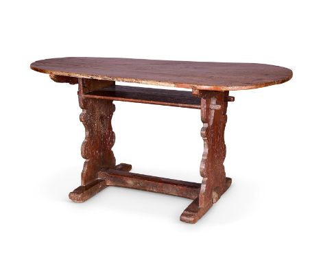  A NORTH EUROPEAN OAK TRESTLE TABLE  18TH CENTURY AND LATER  The rounded rectangular top with a shelf below on shaped end sup