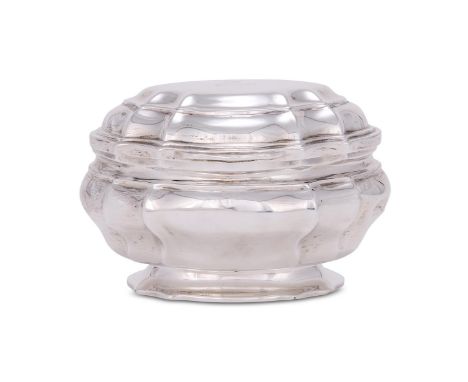 A VICTORIAN SILVER SHAPED OVAL TEA CADDY CHARLES STUART HARRIS, LONDON 1888 The cover engraved with a crest, the interior eng