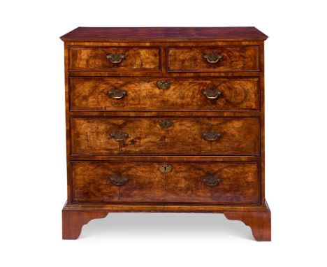 A GEORGE II WALNUT CHEST SECOND QUARTER 18TH CENTURY AND LATER     With a crossbanded and quarter-veneered rectangular top ab