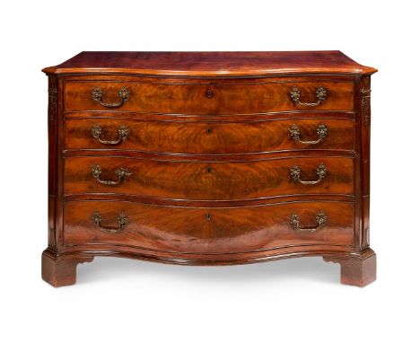 A GEORGE III MAHOGANY SERPENTINE DRESSING-COMMODE  CIRCA 1760 With a cut-cornered moulded top above four long drawers, the fi