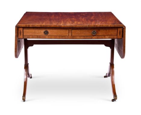 A REGENCY MAHOGANY SOFA TABLE EARLY 19TH CENTURY       With a rounded rectangular twin-flap top and drawers and false drawers