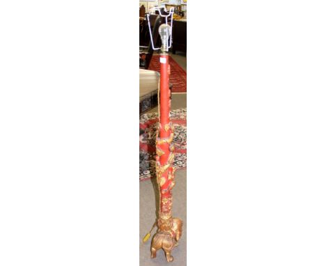 Late 20th century parcel gilded and iron red decorated Oriental standard lamp, the stem carved with dragon and foliage raised