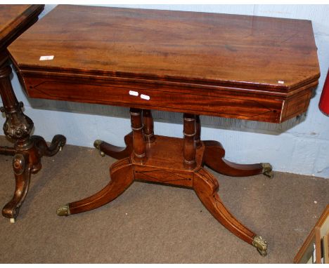 Regency period mahogany card table, fold top with canted front corners and ebonised line inlay throughout raised on four ring