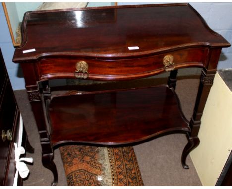 Late 19th/early 20th century mahogany side table, serpentine front with single freize drawer and open shelf below, flanked on