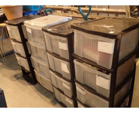 Four plastic four drawer storage units on castors with contents including tools etc 