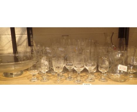 Shelf of drinking glasses, vases etc 