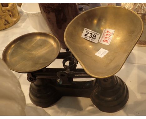 Set of green cast iron kitchen scales with brass pans and weights (in office 9337)