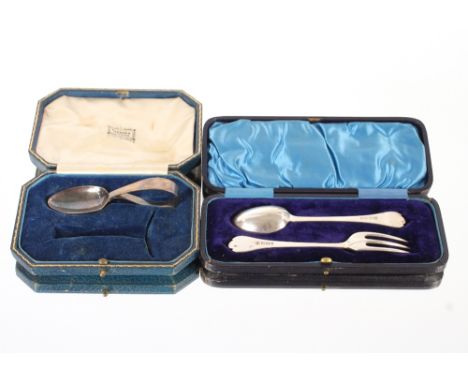 An Edwardian cased silver Christening fork and spoon,&nbsp;with Trefid ends, Sheffield 1904;&nbsp;and a silver child's Christ