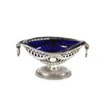 A late Victorian silver oval salt, having and pierced and garland decorated border raised on