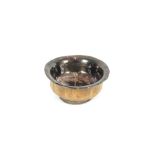 An antique wooden and white metal mounted bowl, of baluster form, the circular foot having raised