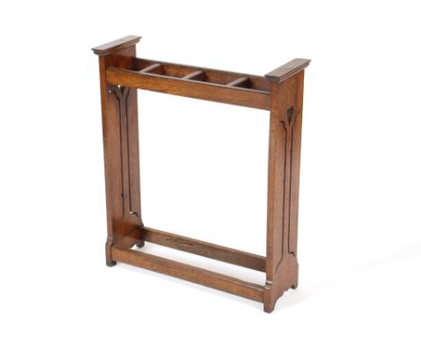 An early 20th Century oak Arts &amp; Crafts design stick stand,&nbsp;shaped pierced ends with heart motifs, 66.5cm wide x 77c