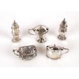 A pair of George V octagonal silver baluster pepperettes, London 1924; a silver octagonal mustard