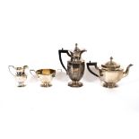A George V silver octagonal shaped four piece tea set, cream jug and matching sucrier, having gilded