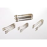 Four various silver sugar tongs, 87.5gms
