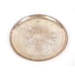 An Italian white metal circular tray, having gadrooned border, stamped 800, R. Miratoli Milano, 29cm