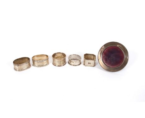 A pair of good quality silver engine turned decorated serviette rings,&nbsp;three others 141.7gms and a small silver mounted 