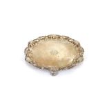 A late Victorian silver card tray, by The Goldsmiths and Silversmiths Company, having pie crust