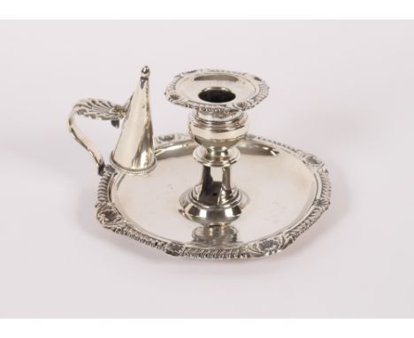 A George III silver chamber stick, having gadrooned and shell decorated border, Birmingham 1814,&nbsp;286.7gms (without snuff