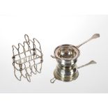 A silver tea strainer and bowl, London 1928/29; and a small silver four division toast rack,