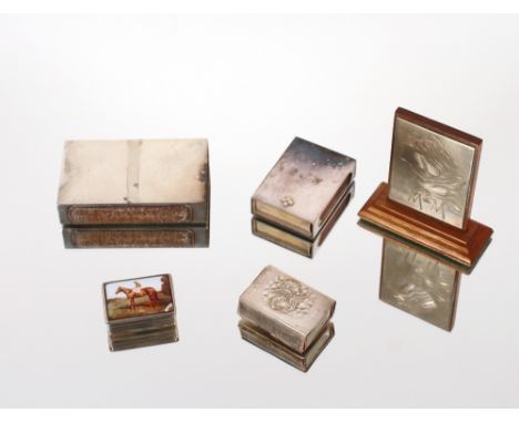 A small silver and enamel patch box, the lid decorated with a horse and jockey AF; three silver matchbox holders and a white 