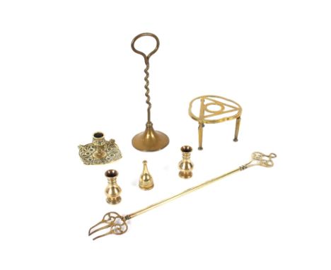 A brass hand bell,&nbsp;with turned wooden handle; a brass door stop; a trivet; a chamber stick; toasting fork etc.