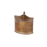 An Edwardian silver tea caddy, of elliptical shape, the hinged lid surmounted by a flambé finial,